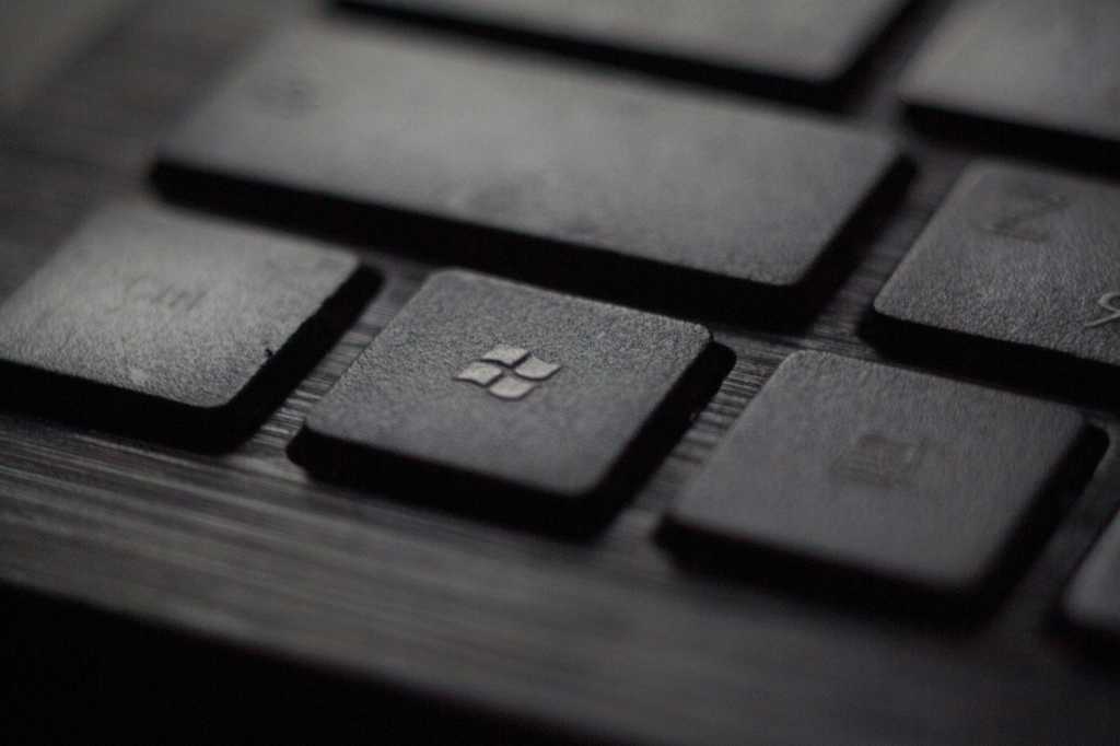 Black Windows Key Focused Among Black Laptop Keyboard.jpg