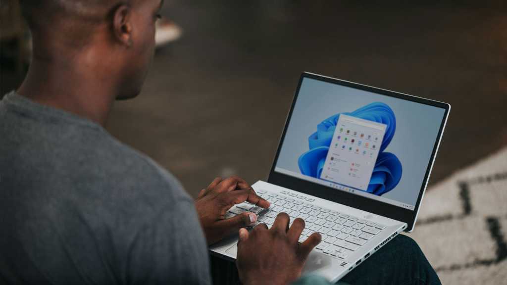 Man On Windows 11 Laptop With Apps Selection 2.jpg