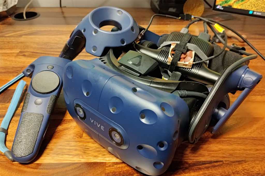 Vive Pro Vr Headset With Controllers On Wooden Desk.jpg