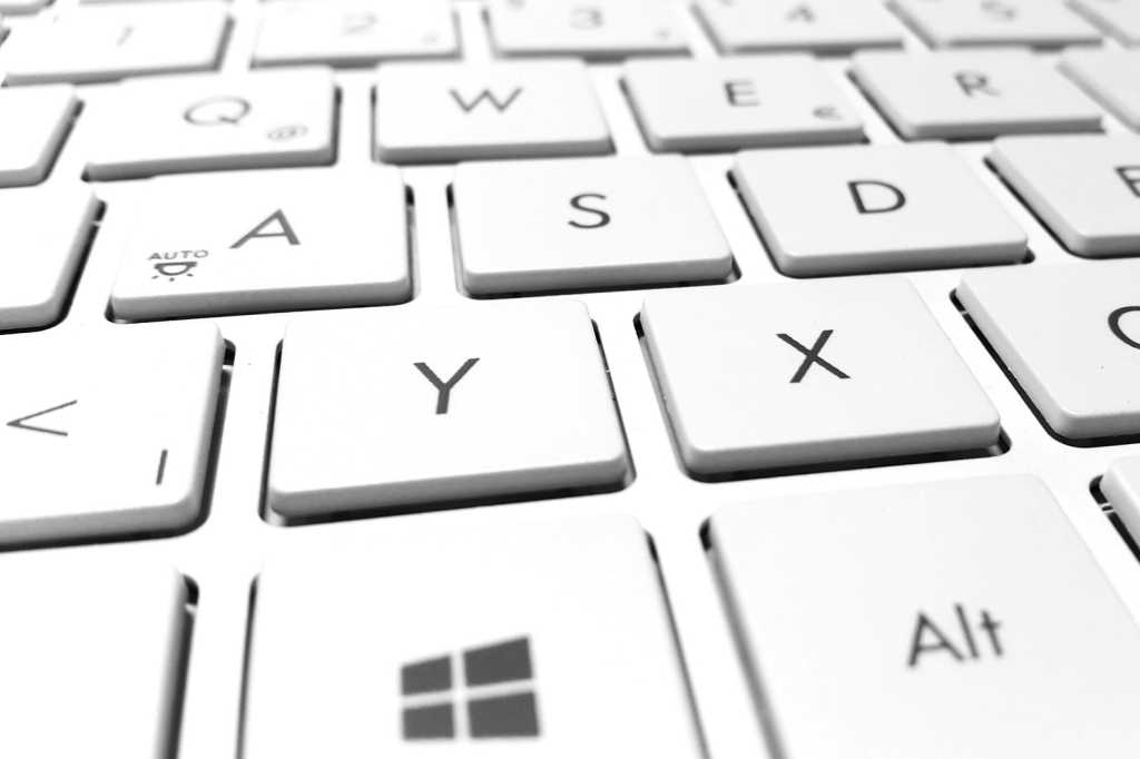 Closeup Of White Laptop Keyboard With Windows Key Prominent.jpg