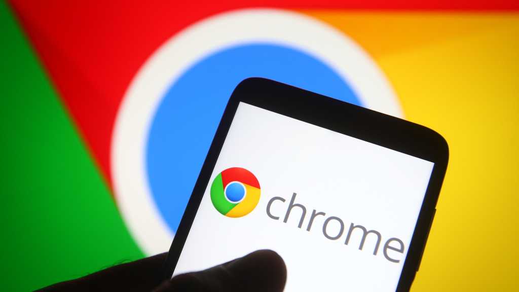 Chrome logo on phone in front of larger chrome display in background.jpg