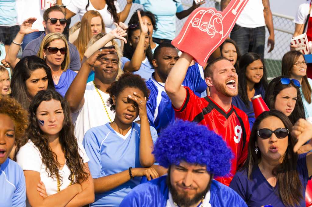 Sports one fan cheers the opposing team by fstop123 gettyimages 471924821 100817683 orig.jpg